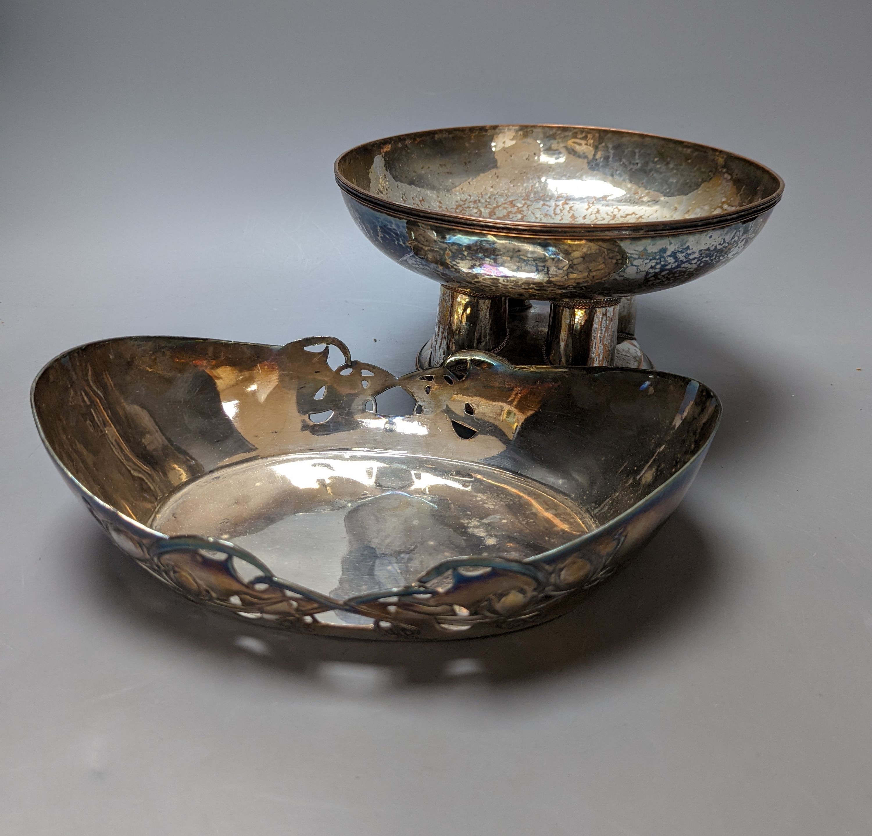 A Tudric pewter oval bowl, model no. 0535, 25cm long and an Arts & Crafts style plated pedestal bowl, 21.5cm diameter